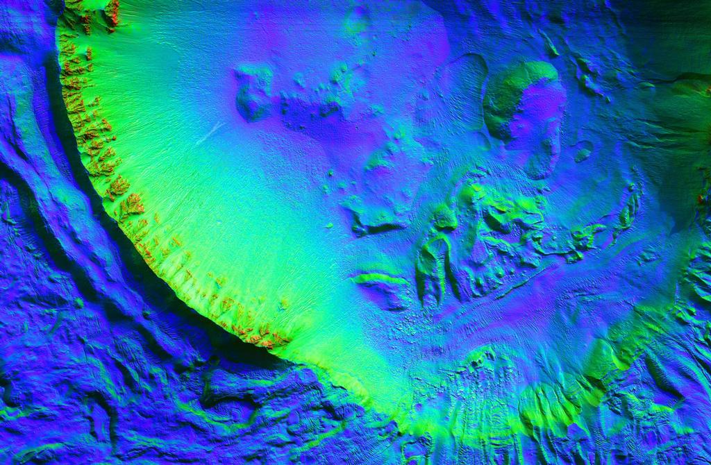 This unnamed impact crater is about 8 kilometers in diameter and contains numerous gullies.