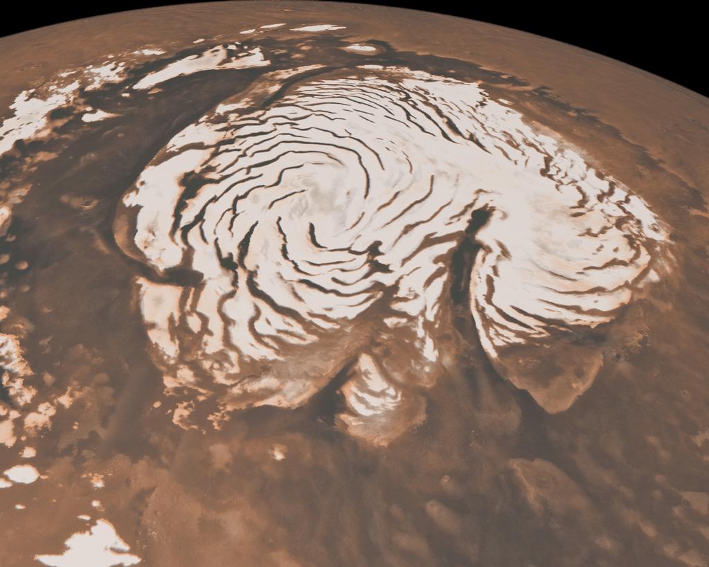 This image, combining data from two instruments aboard NASA's Mars Global Surveyor, depicts an orbital view of the north polar region of Mars.
