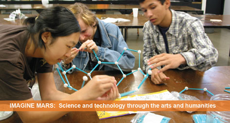 Imagine Mars: Science and technology through the arts and humanities. A group of three young people work together on a project.