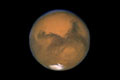 Link to Mars: Extreme Planet - Picture of the entire planet Mars with the blackness of space around it.