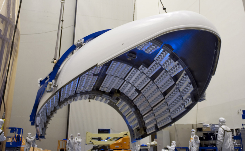 In the Payload Hazardous Servicing Facility at NASA's Kennedy Space Center in Florida, the fairing acoustic protection (FAP) system lining the inside of the Atlas V payload fairing for NASA's Mars Science Laboratory (MSL) mission comes into view as the fairing is lifted into a vertical position.