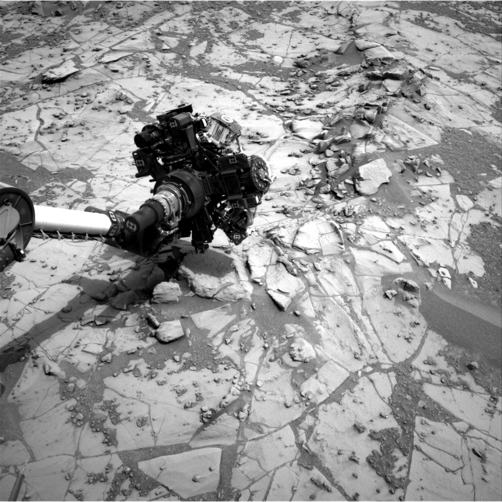 Navcam image showing Curiosity's arm outstretched, doing contact science.
