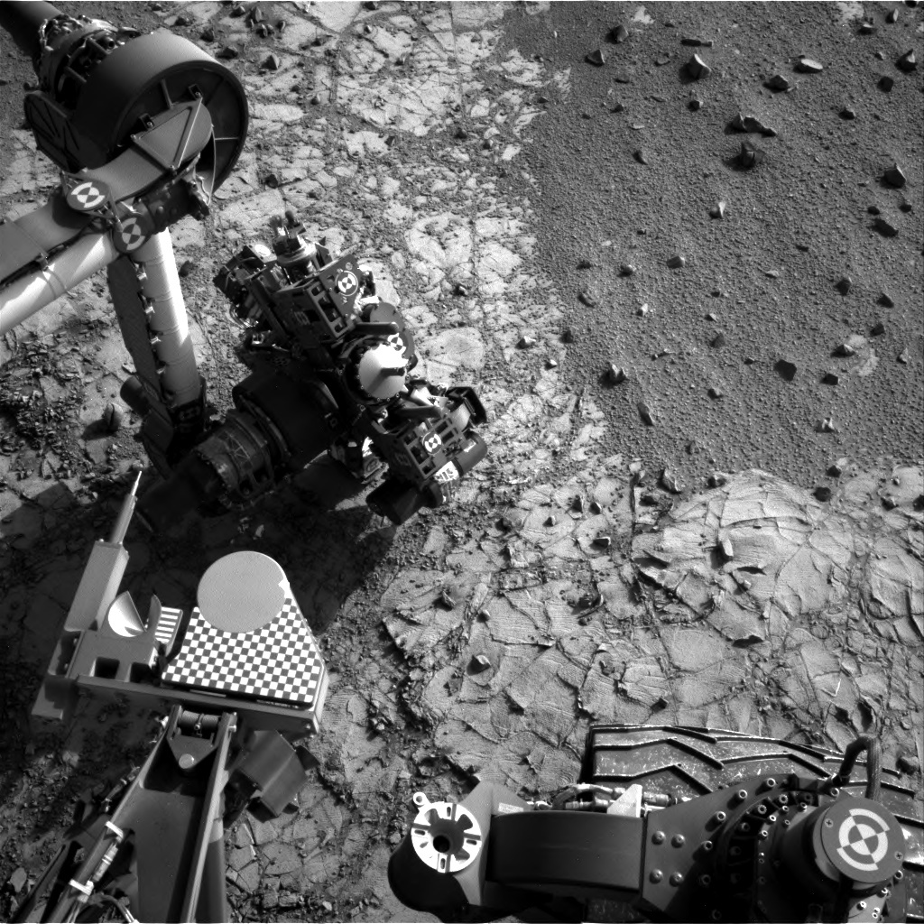 Navcam image of the arm with APXS placed on the drill tailing pile.