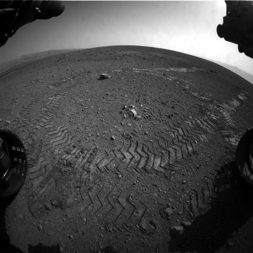 This image shows the tracks left by NASA's Curiosity rover on Aug. 22, 2012, as it completed its first test drive on Mars.