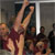 In this image, a group of men and women are celebrating the successful orbit insertion of Mars Reconnaissance Orbiter on March 10, 2006.  Mission manager Jim Graf is featured.  He is a Caucasian man in his fifties with  brown hair and a salt and pepper goatee.  His arms are raised in celebration.  Behind him is the Director of NASA's Jet Propulsion Laboratory, Dr. Charles Elachi.  He is a  man in his fifties with thinning brown and gray hair and glasses.  They are both wearing maroon-colored short-sleeved shirts with mission emblems on them.  Dr. Elachi has a brown leather jacket on also.  They are surrounded by other men and women clapping in mission control.