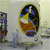 This image features the large nose cone that will protect the Mars Reconnaissance Spacecraft before and during launch.  The white structures larger, lower cylinder is capped by a cone-shaped piece.  The colorful Mars Reconnaissance logo adorns the side.  The logo background is black and dotted with simulated stars.  The cartoon spacecraft is 'conducting science' and is featured with brightly colored swirls that simulate the spacecrafts orbit around the planet Mars.  Within the logo, the swath of the HiRISE camera is simulated and that swath echoes the cone shape of the fairing itself.  A person dressed in light blue cleanroom attire (called a 'bunny suit') stands in front of the fairing, which is nearly four times his or her height.
