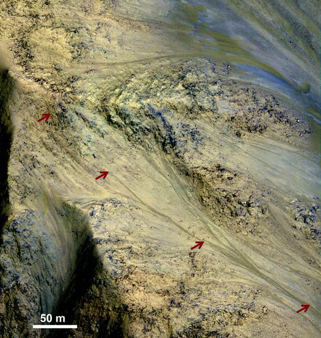 This image includes an especially long example of a type of dark marking that advances down some Martian slopes in warmer months and fades away in cooler months.