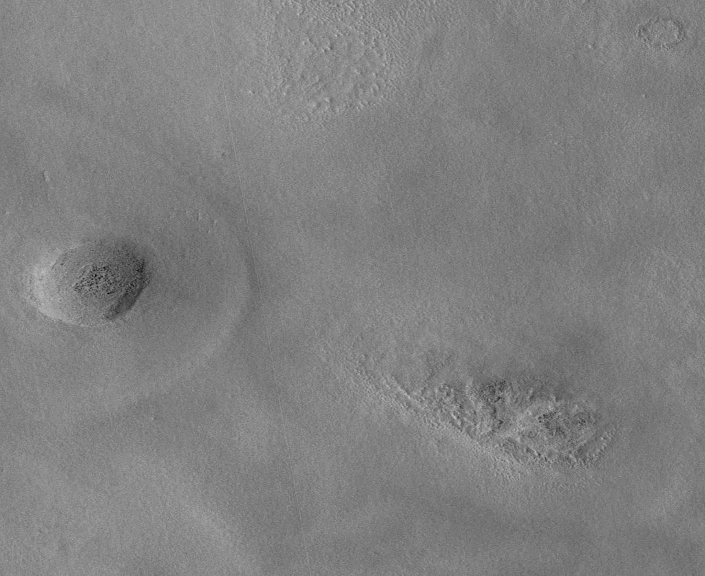 The team operating the Context Camera (CTX) aboard NASA's Mars Reconnaissance Orbiter frequently discovers new dark spots on Mars that, upon closer examination, turn out to be brand new impact craters.