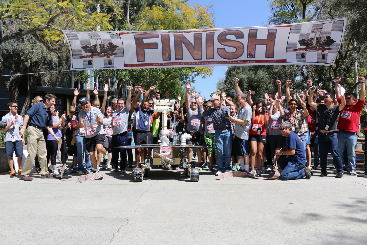 JPL employees show their support for the Opportunity rover's marathon-run on Mars, by running a marathon-length relay of their own on April 9, 2015.