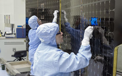 View image for Technicians at KSC Prep Solar Panels