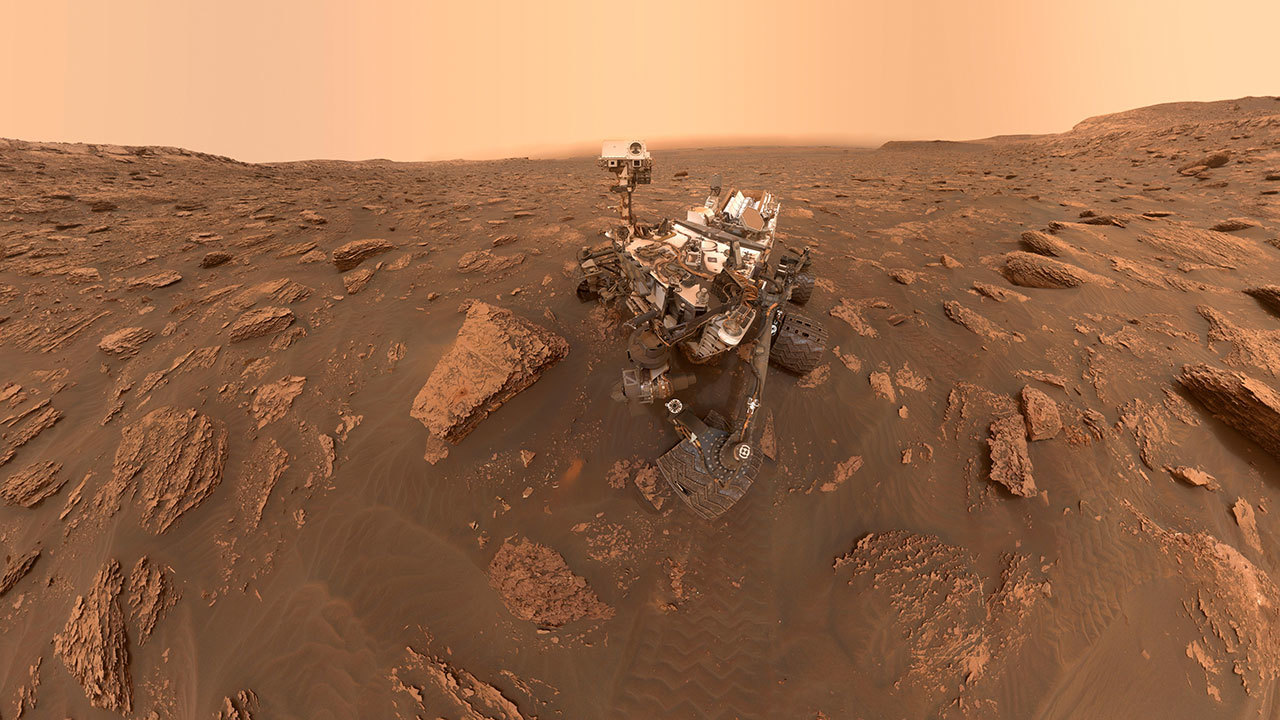 A self-portrait of NASA's Curiosity rover taken on Sol 2082 (June 15, 2018). A Martian dust storm has reduced sunlight and visibility at the rover's location in Gale Crater.