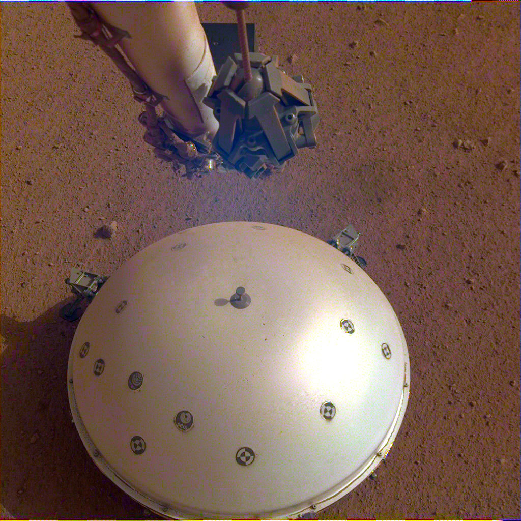 This image shows InSight's domed Wind and Thermal Shield, which covers its seismometer. The image was taken on the 110th Martian day, or sol, of the mission. The seismometer is called Seismic Experiment for Interior Structure, or SEIS.
