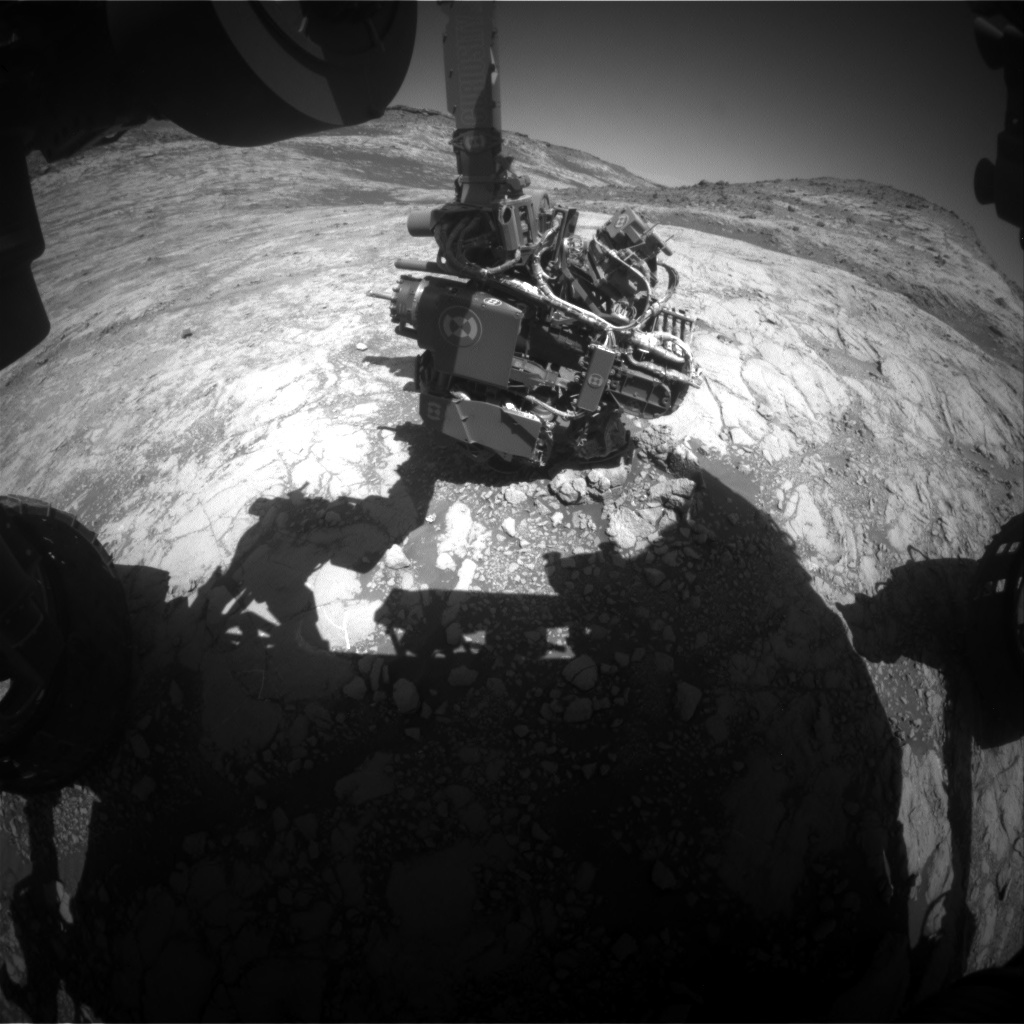 This Hazcam image shows Curiosity's arm extended out to perform an APXS analysis of the bedrock. Curiosity has to know the exact angle of every joint to move safely. 