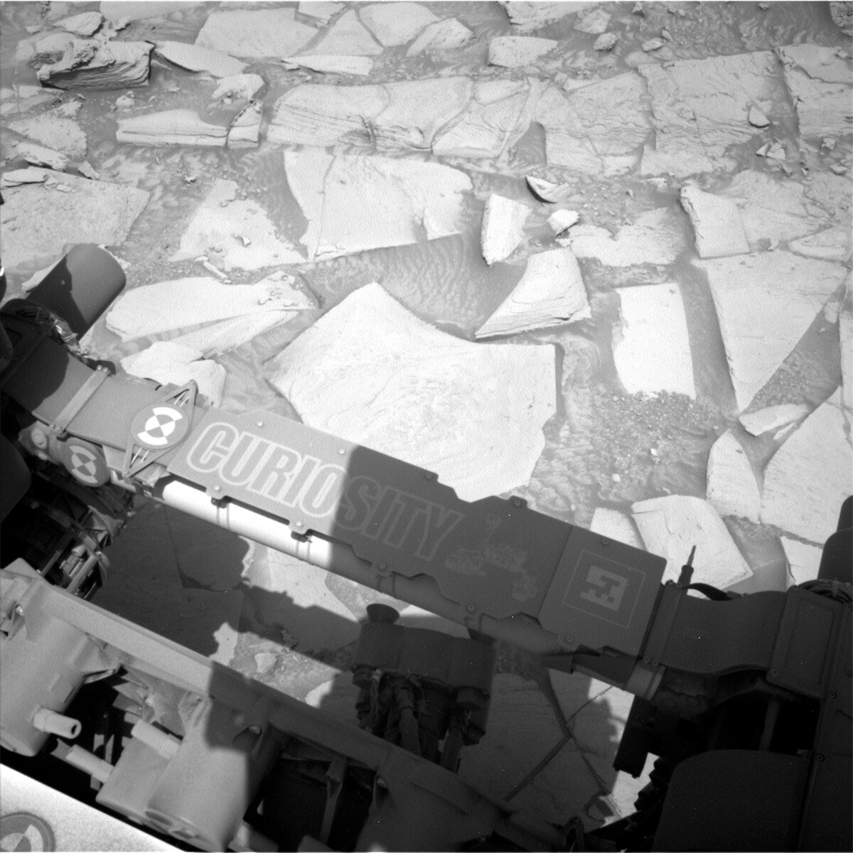 This image of Curiosity's nameplate above the Mars surface was taken by Left Navigation Camera onboard NASA's Mars rover Curiosity on Sol 4096.