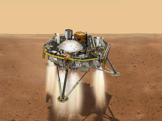 This is an illustration showing a simulated view of NASA&#39;s InSight about to land on the surface of Mars. This view shows the top of the spacecraft.
