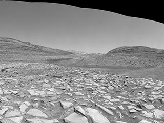 After arriving at Gediz Vallis channel, NASA’s Curiosity Mars rover captured this 360-degree panorama using one of its black-and-white navigation cameras on Feb. 3. The formation has scientists intrigued because of what it might tell them about the history of water on the Red Planet.